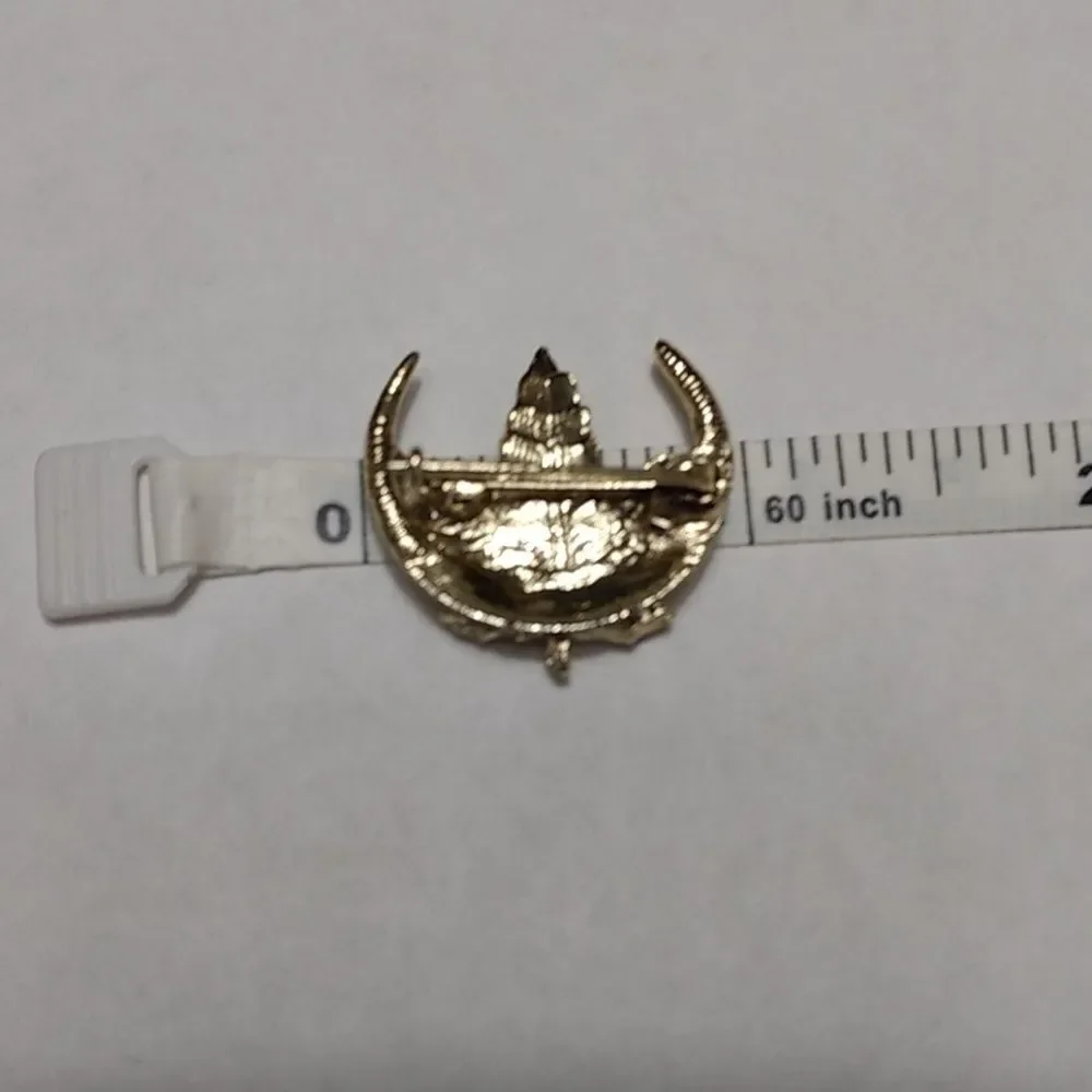 Gold tone rhinestone leaf brooch